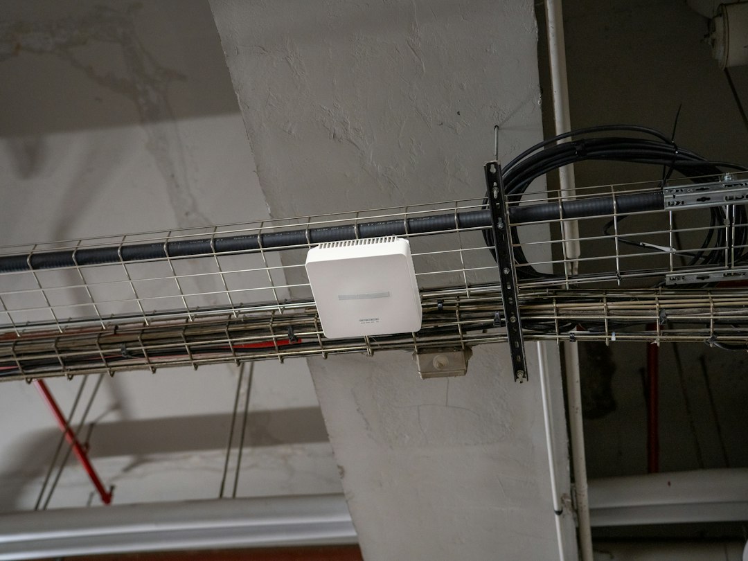 A wireless access point mounted above a ceiling